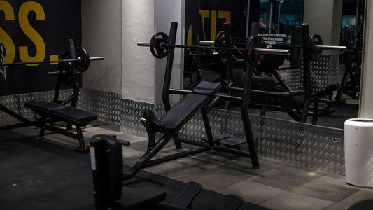 Modern gym with adjustable bench press and gym equipment in Singapore fitness center.