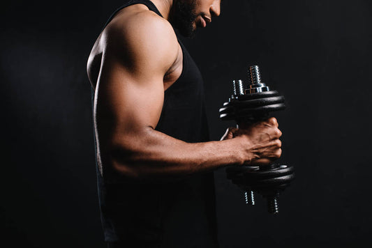 a guy holding dumbells
