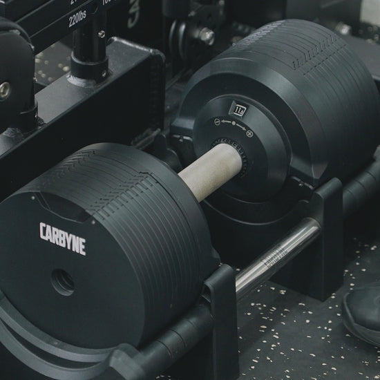 CARBYNE 415 325 235 adjustable dumbbell demonstration video showing weight adjustment mechanism